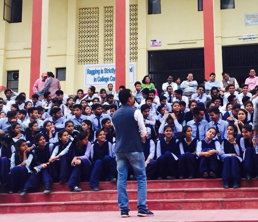 Jogi engaging with large crowd of students